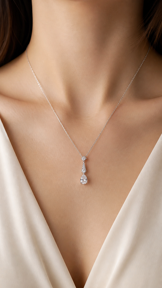 Model wearing Lumière Drop pear lab-grown diamond necklace