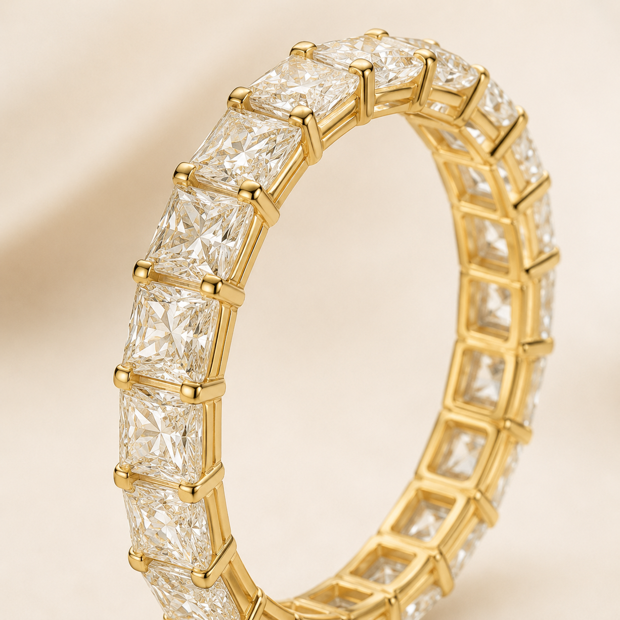 Close-up of Elmivra E color VS1 princess cut lab-grown diamond eternity band in yellow gold