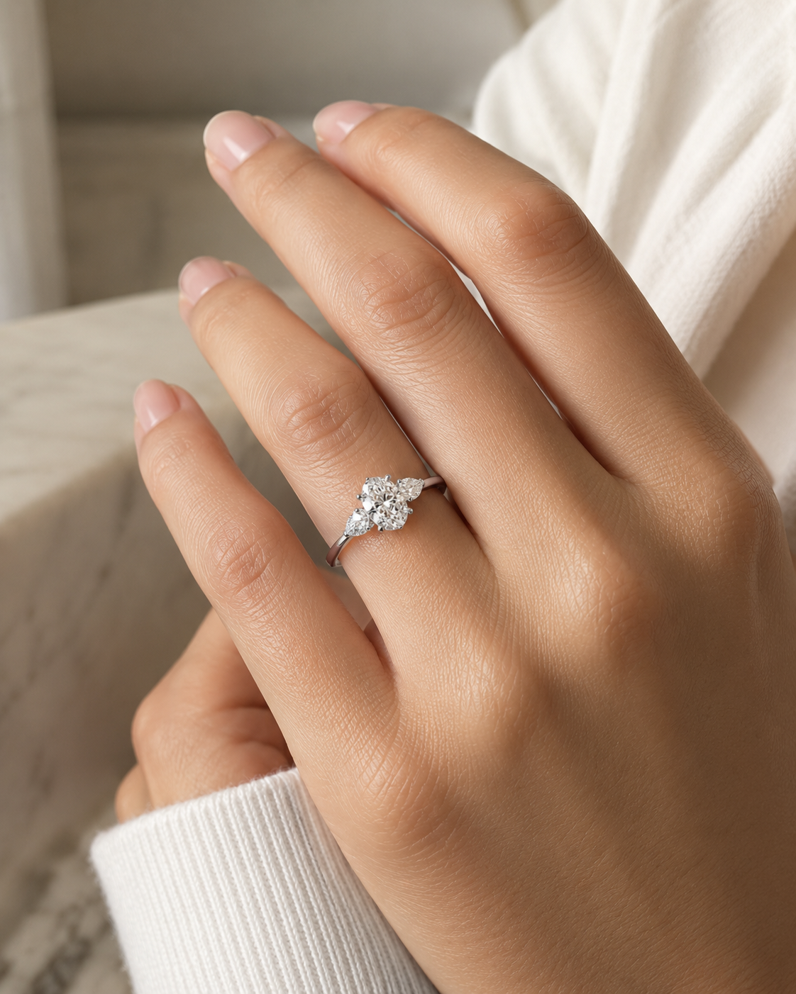 Celeste Three-Stone 2 carat oval lab-grown diamond ring model wearing image