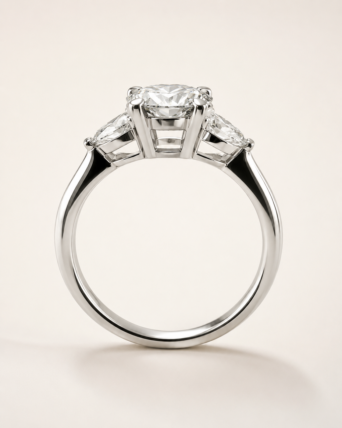Celeste Three-Stone oval ring side detail showing setting structure and pear side stones