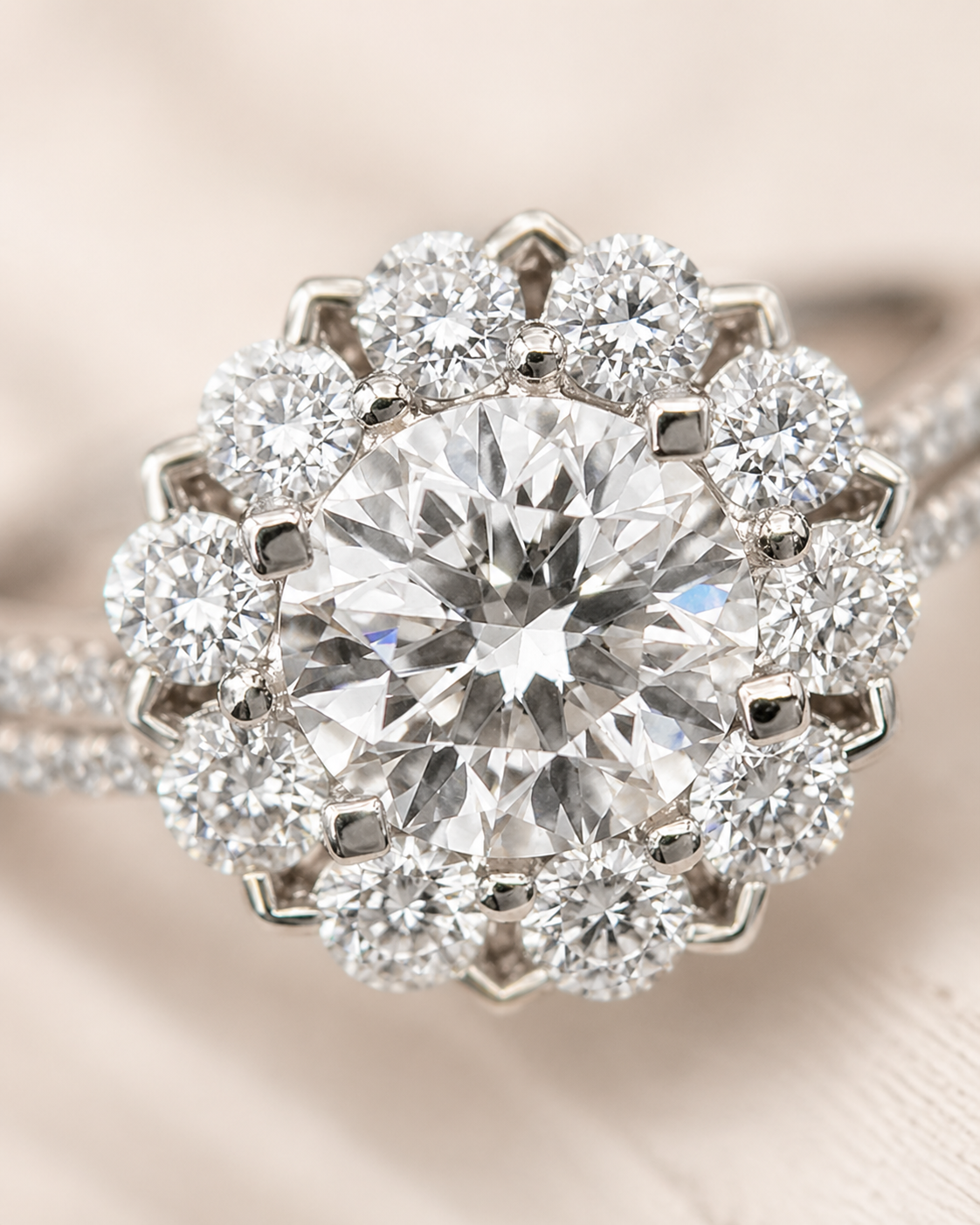 Close-up of round lab-grown diamond halo ring with pavé split shank