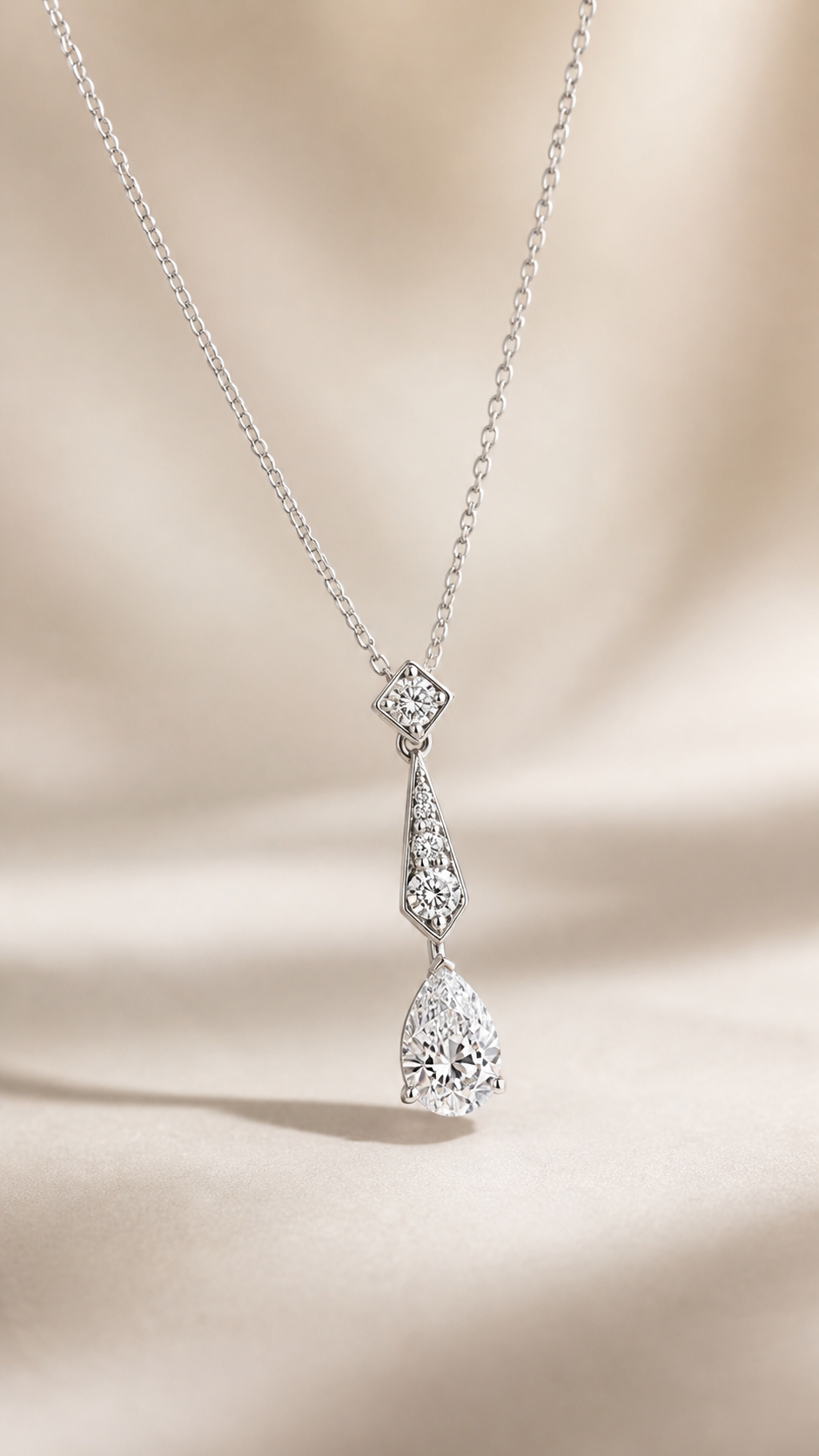 Angled view of Lumière Drop pear lab-grown diamond necklace