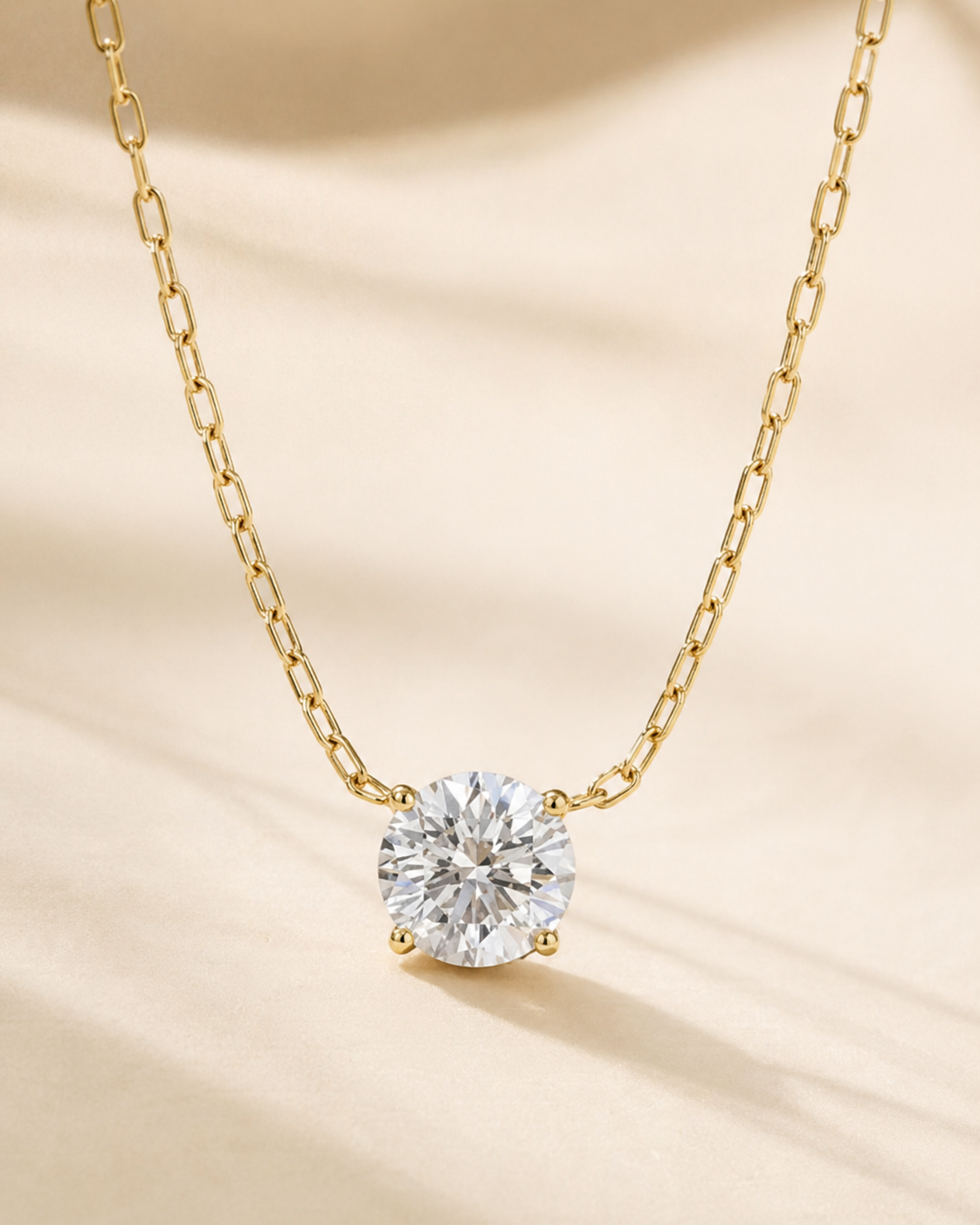 Angled view of Elmivra Lumière Solitaire 1 carat round diamond pendant necklace