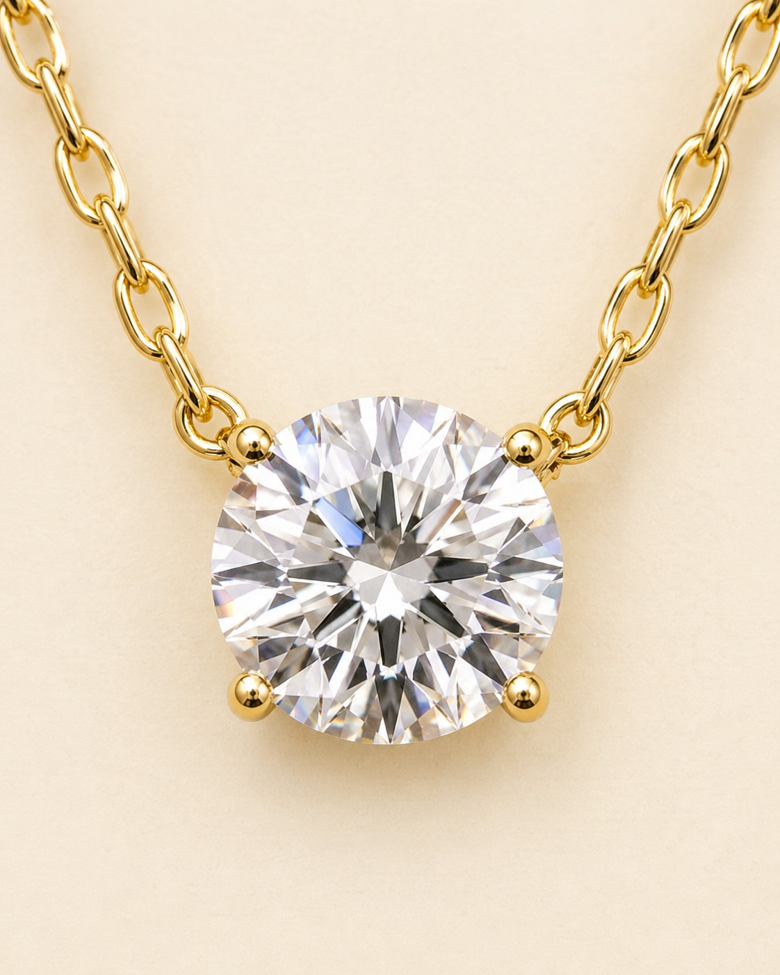 Detailed view of round solitaire lab-grown diamond necklace with 18K yellow gold chain