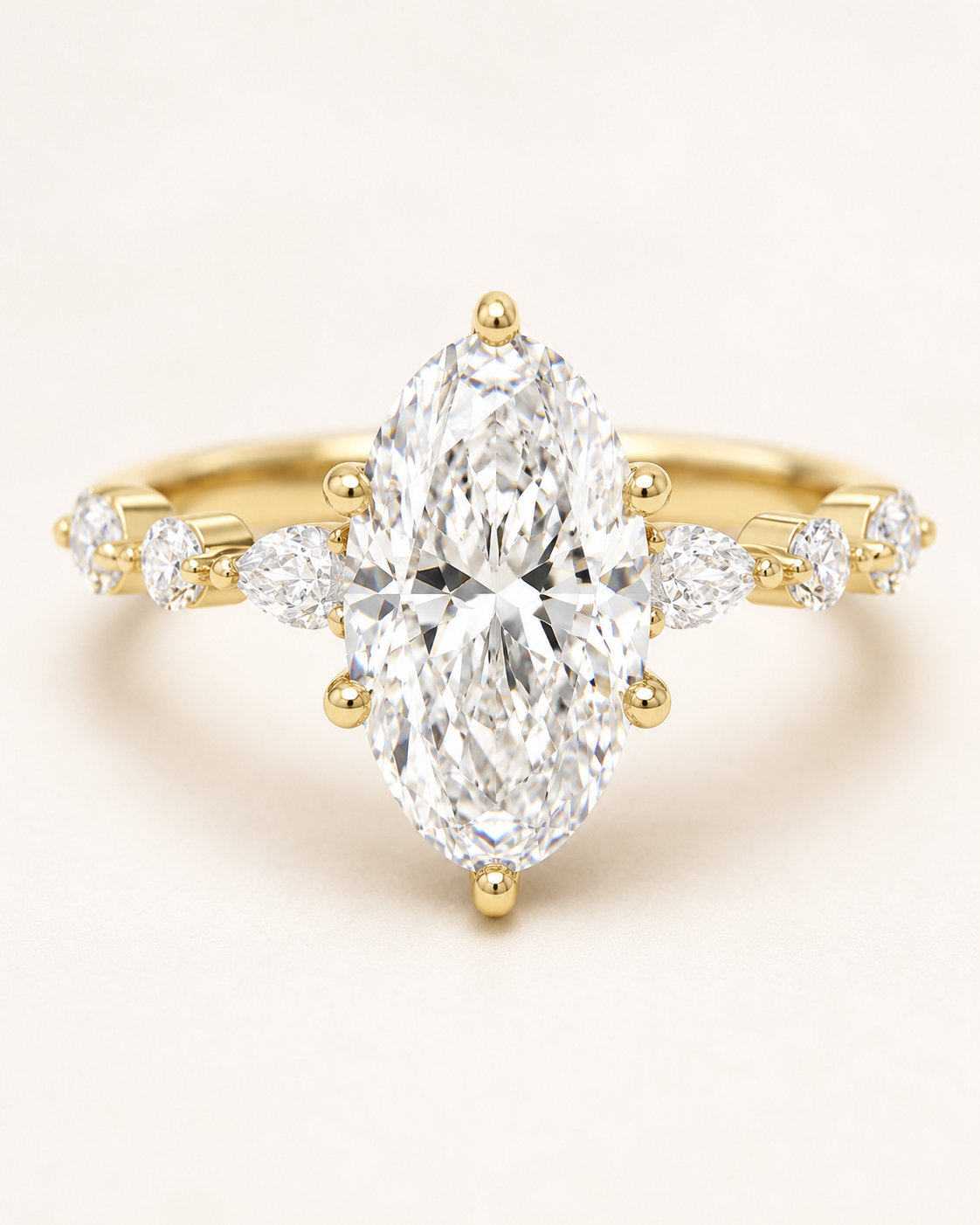 Elmivra Marquise Side Stone Oval lab-grown diamond ring in 18K Yellow Gold closeup