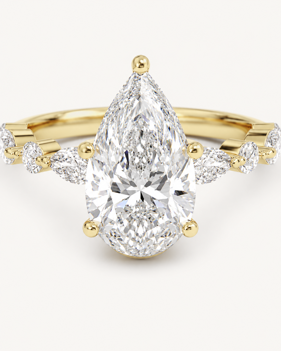 Elmivra Marquise Side Stone Pear lab-grown diamond ring in 18K Yellow Gold closeup