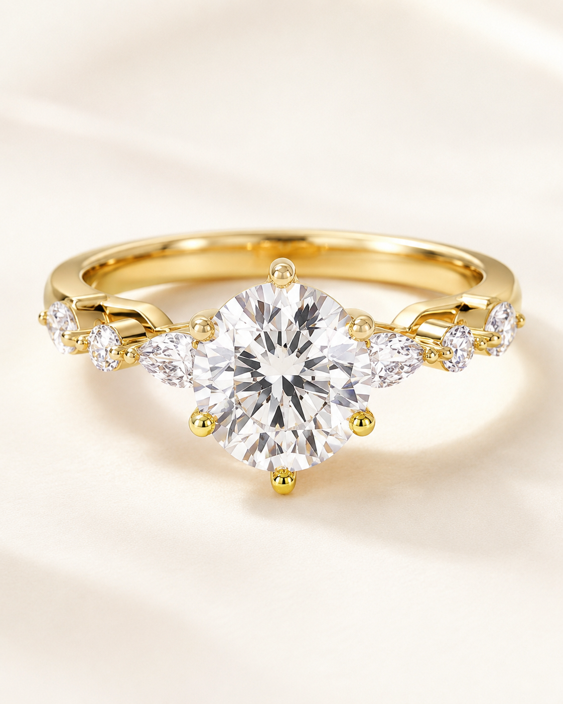 Elmivra Marquise Side Stone Round lab-grown diamond ring in 18K Yellow Gold closeup