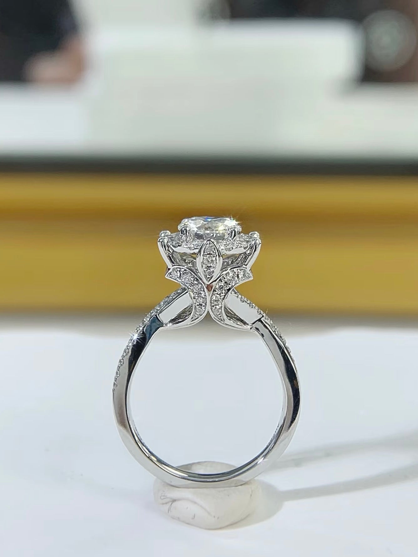 Detail view of Petal Halo round halo ring setting