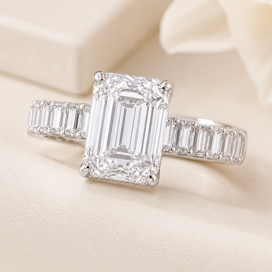 Elmivra 5ct emerald cut lab-grown diamond ring with hidden halo and baguette diamond band front view